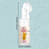 A white bottle of Pet Paw Cleaner foam for cats and dogs with a green cap and a foam applicator visible.