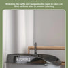 A gray semi-enclosed cat litter box with a raised fence and baffle designed to prevent sand splashing.
