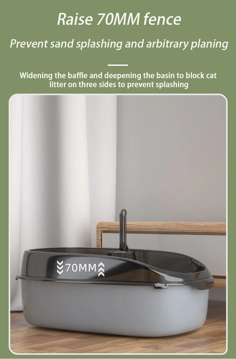 A gray semi-enclosed cat litter box with a raised fence and baffle designed to prevent sand splashing.