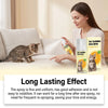 A woman is applying a spray bottle of Pet Forbidden Area Spray to a cat on a sofa, demonstrating its long-lasting effect.