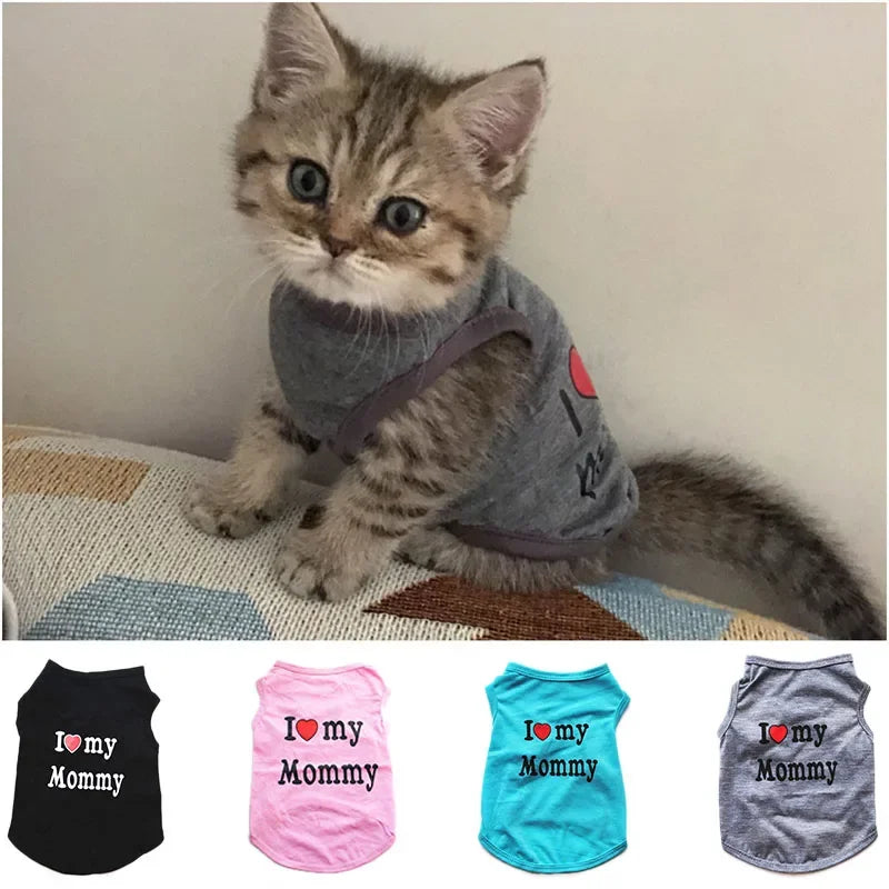 A set of four print vests for pets featuring the text I love my Mommy in black, pink, blue, and gray.