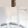 A set of double-sided dog grooming combs and brushes with solid wood handles.