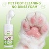 A bottle of Pet Paw Cleaner foam is shown next to a pink pet paw covered in cleaning foam.