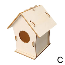 A small, unfinished wooden bird house with a pitched roof and an oval entrance, tied with hemp rope.