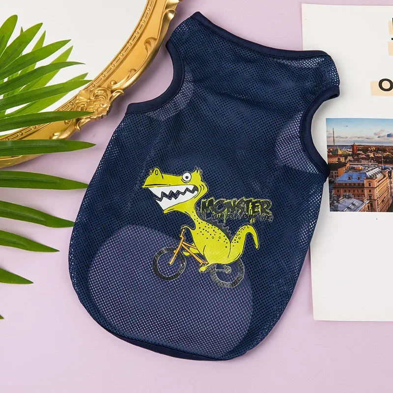 Navy breathable mesh pet vest featuring a yellow cartoon monster riding a bicycle