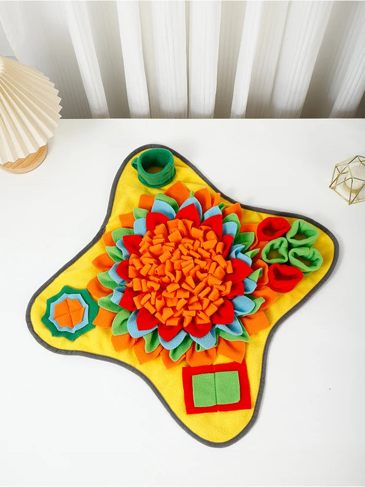 A colorful, flower-shaped snuffle mat for dogs with various fabric textures and colors.