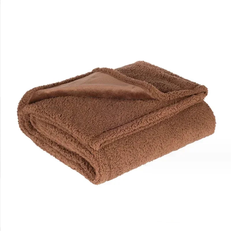 A folded brown microfiber blanket with a fuzzy texture.
