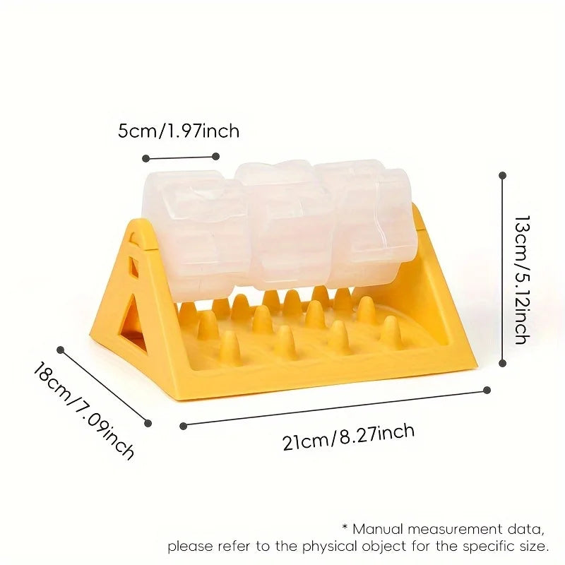 A yellow interactive dog food puzzle dispenser with silicone food pieces and a plastic tray.