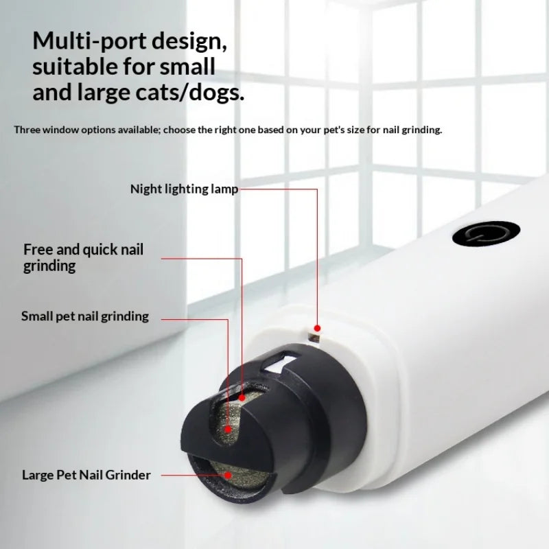 A white multi-port pet nail grinder with a grinding head shown on a table.