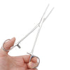 A hand holds a pair of stainless steel pet ear hair tweezers with curved tips.