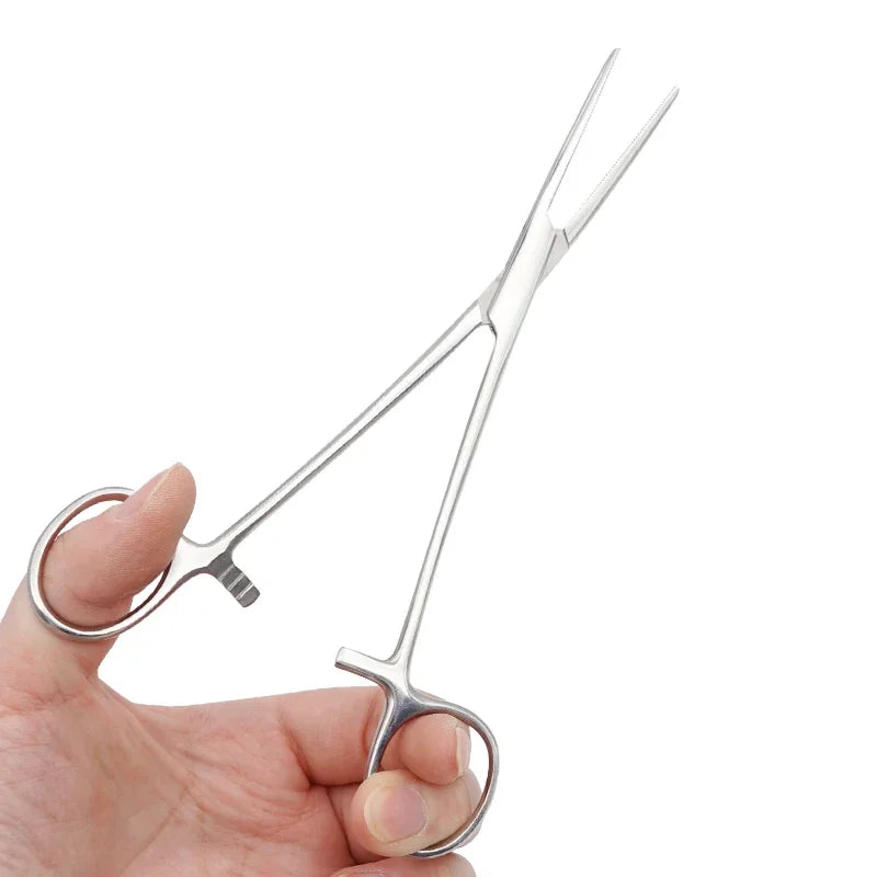 A hand holds a pair of stainless steel pet ear hair tweezers with curved tips.