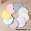 A set of nine round silicone pet feeding mats in various pastel colors arranged in a circle.