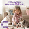 A young girl is interacting with a cat while using a plug-in calming diffuser product.