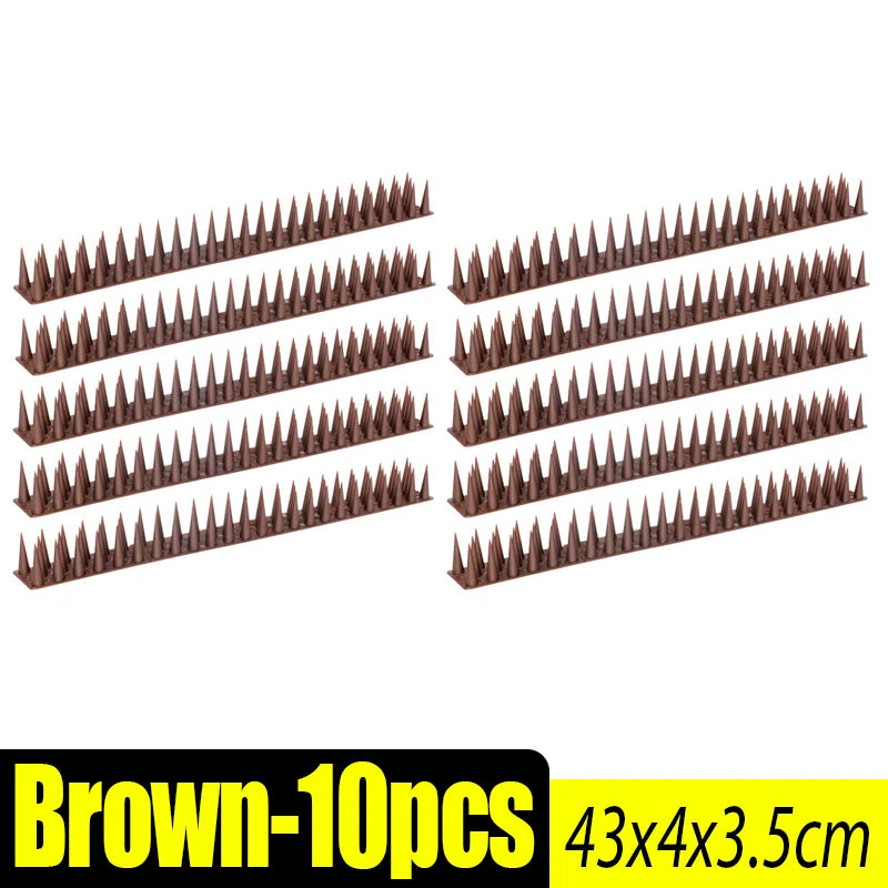 Brown bird and pest repellent spikes in various lengths arranged in rows