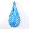A bright blue reusable foldable bubble shopping bag with white polka dots.