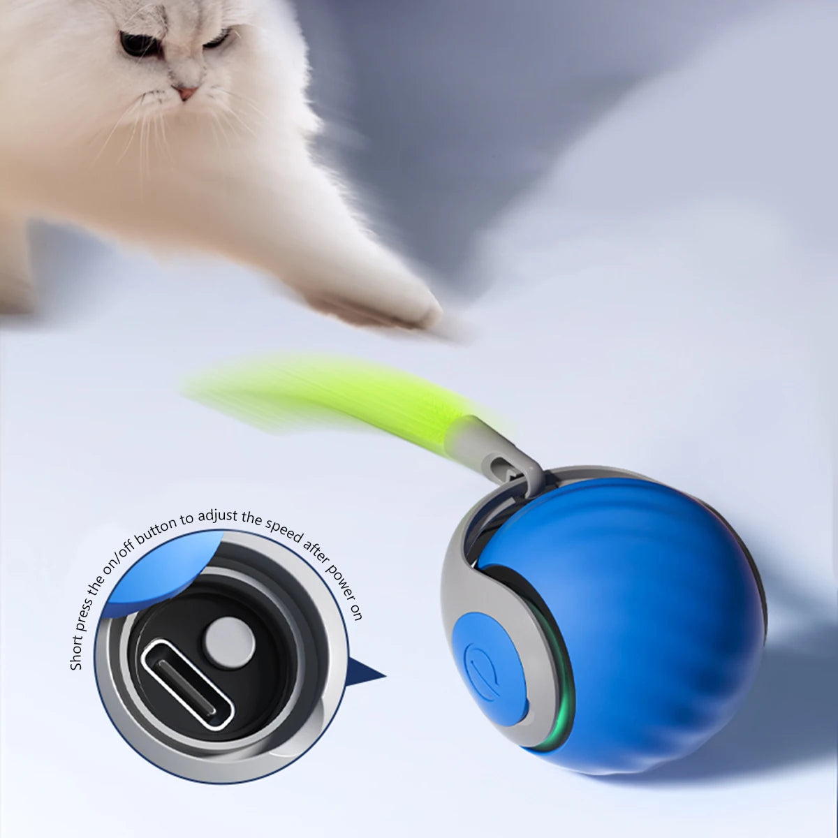 A blue interactive cat toy ball with a green tail, showing the on/off button mechanism.