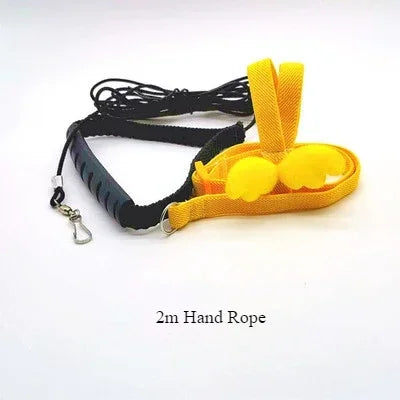A set of yellow bird training harness and black lead rope with a clasp.