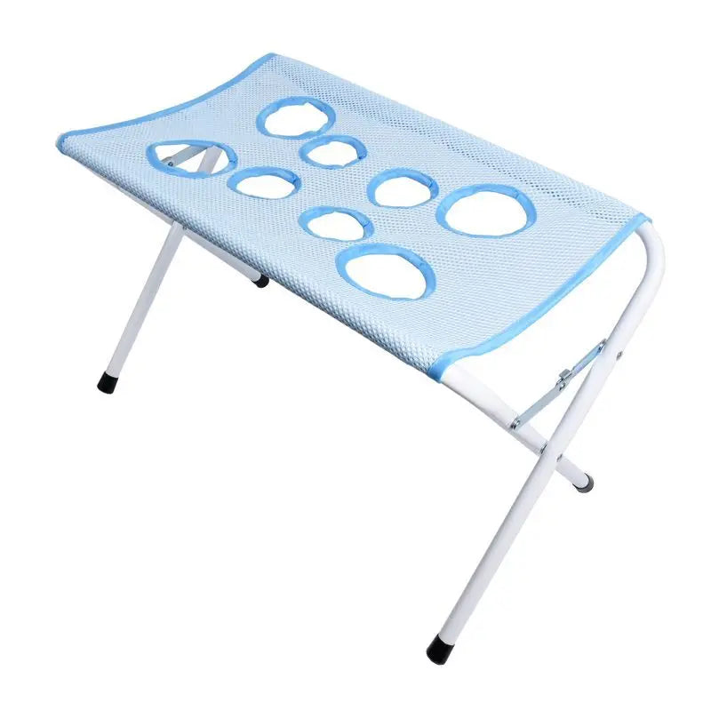 Hellblaue faltbare Pflegematte für Haustiere mit Netzoberfläche und Metallrahmen.