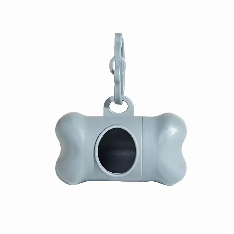 Light gray bone-shaped dog waste bag dispenser with a hanging loop.