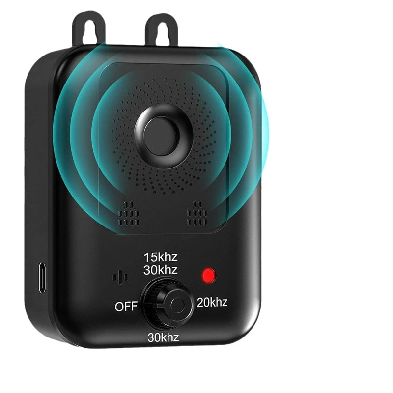 A black ultrasonic dog bark deterrent device with a circular speaker grille and an on/off switch.