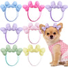 A collection of 30 handmade dog hair bow sets in various colors and styles for dogs.