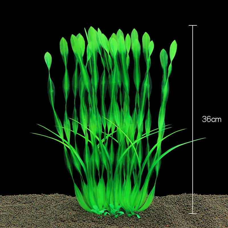 Un touffe de plantes aquatiques artificielles vert vif poussant dans du sable avec un marqueur d'échelle.