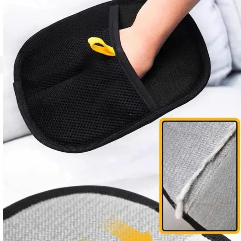 Black double-sided pet grooming gloves with yellow tips shown on a hand