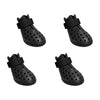 Four black waterproof silicone pet rain boots for dogs shown from different angles
