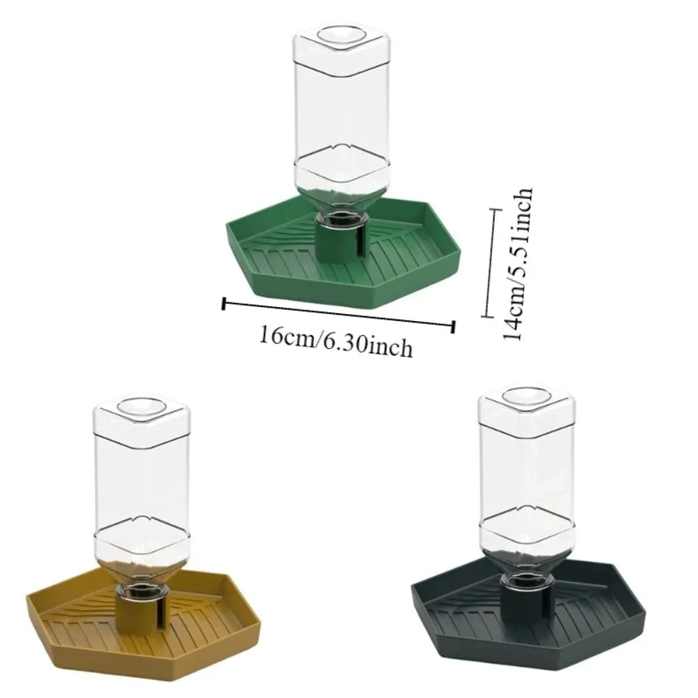 A clear glass automatic reptile water dispenser bowl with a green and yellow plastic base.