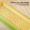 A yellow and green hollow tray with a grid design for growing seeds or plants.