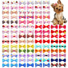 A collection of 30 handmade dog bows in various colors and patterns for hair accessories.