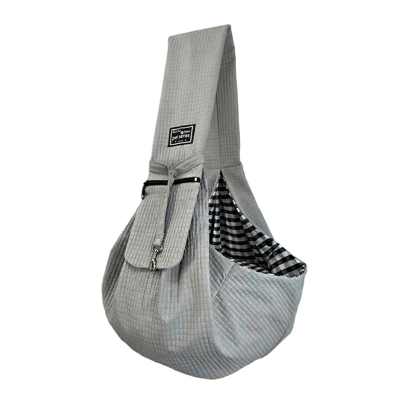 A light gray fabric crossbody pet carrier bag for dogs and cats with a striped pattern.