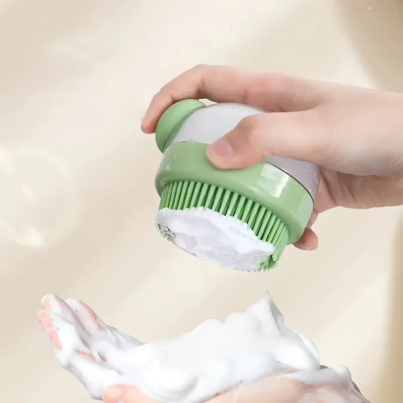 A hand is using a green pet bath brush with a built-in dispenser to apply shampoo foam onto a pet's fur.