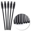 A set of disposable black eyelash and eyebrow brushes displayed vertically.