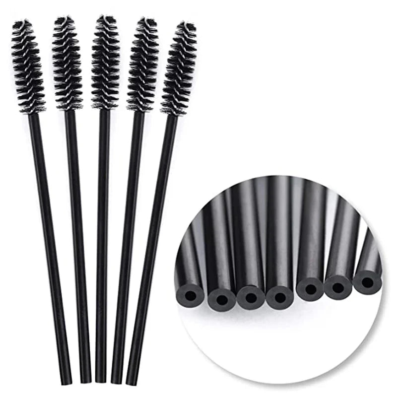 A set of disposable black eyelash and eyebrow brushes displayed vertically.
