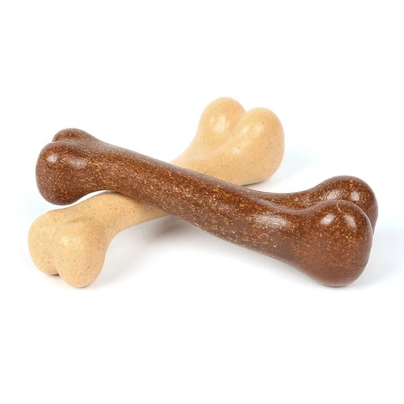 A natural wood chew toy for dogs shaped like a bone, showing various light brown and dark brown tones.