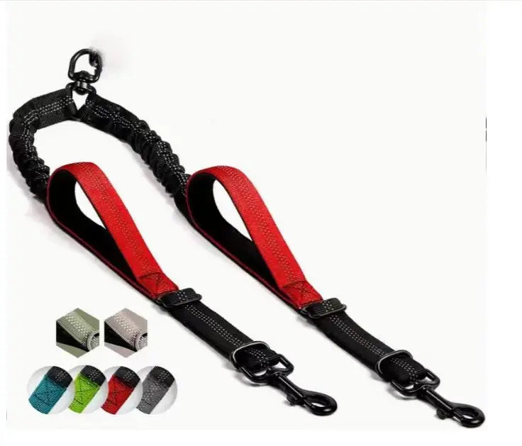 Black and red dual dog leash coupler with padded handles and shock-absorbing bungee.