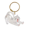 A clear, stylized cat figurine attached to a gold-colored keyring.