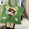 A green mesh pet carrier backpack shaped like a fluffy cat with white fur and dark eyes.