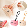 Reusable pet hair roller toys in pink and beige with cartoon designs being held by a hand