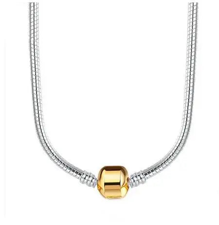 A silver snake chain necklace with a heart charm displayed against a white background.