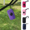 A set of purple, pink, and black portable mesh dog waste bag dispensers hanging from a strap.