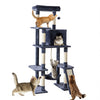 A multi-level cat tree with various platforms and a cozy condo, featuring several cats of different colors.