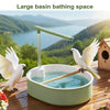 A large basin bathing space featuring an automatic bird bathtub with a resting stick, set outdoors.