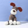 A handmade plush toy of a donkey dog with brown and white fur and reddish-brown ears.