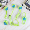 A set of bright lime green rope balls with blue accents used as a durable dog toy for chewing and teething.