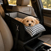 A foldable dog car seat with a black frame and checkered fabric is shown inside a car, resting on a seat.