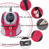 Pink and gray portable pet carrier backpack with double shoulder straps, zip opening, storage pocket, and safety locking buck