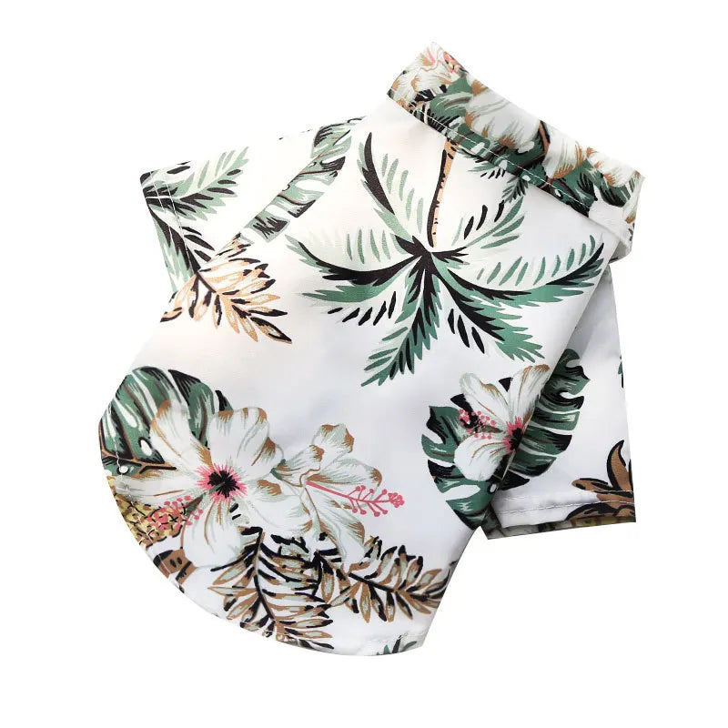 White fabric shirt with a tropical leaf print in shades of green and brown