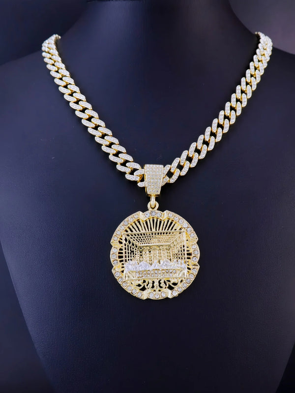 A gold plated necklace featuring a chain and a medallion pendant depicting the Last Supper.